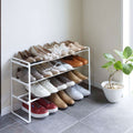 White Yamazaki Frame Elastic three-tier shoe rack with shoes