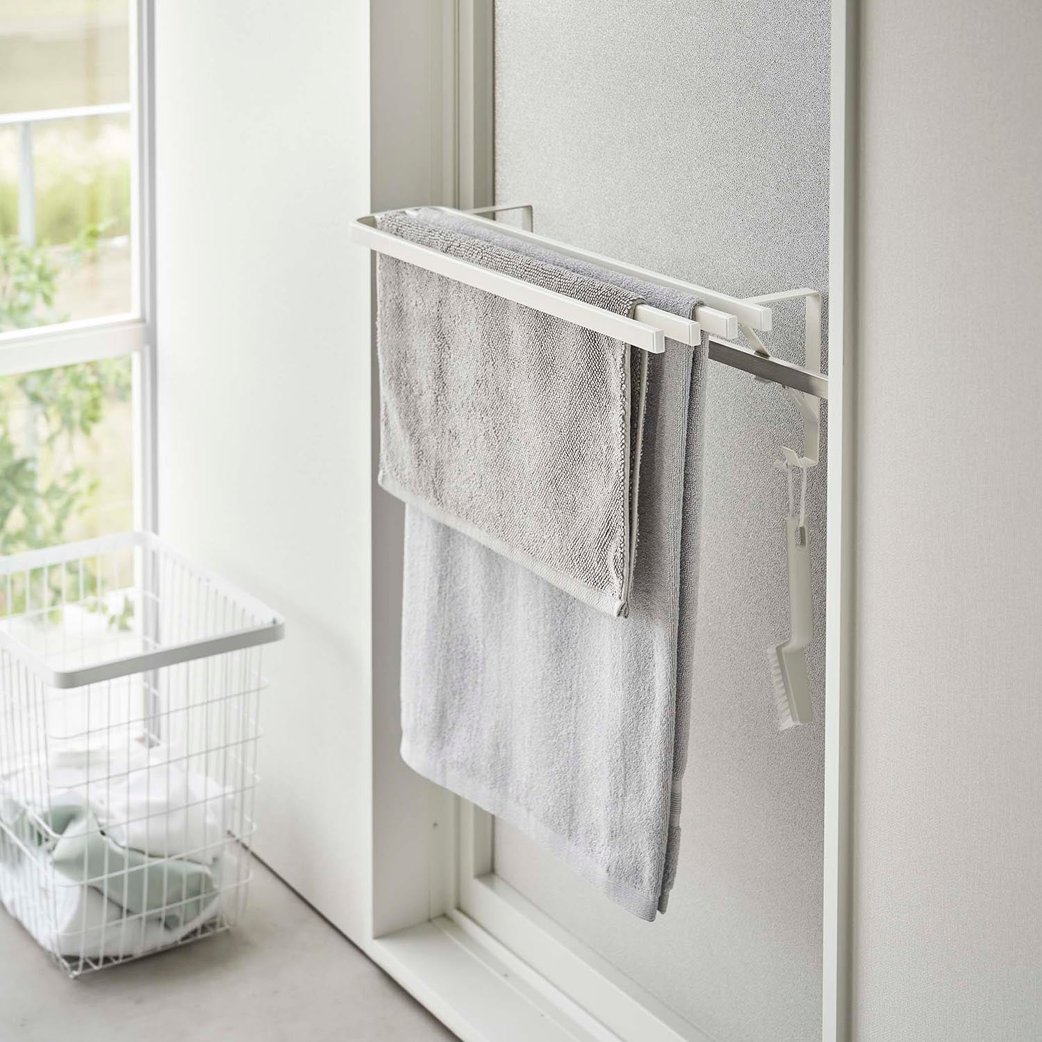 White Yamazaki Tower Doorframe Bath Towel Holder installed