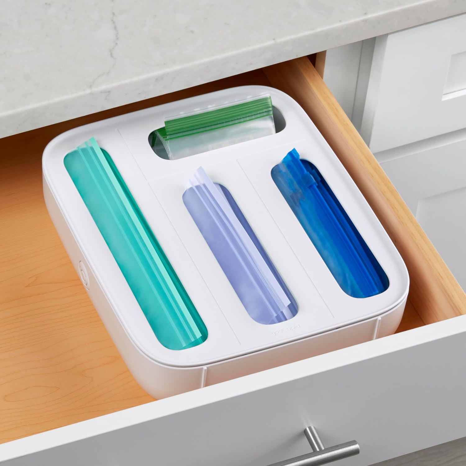 White YouCopia StoraBag dispenser shown in drawer use