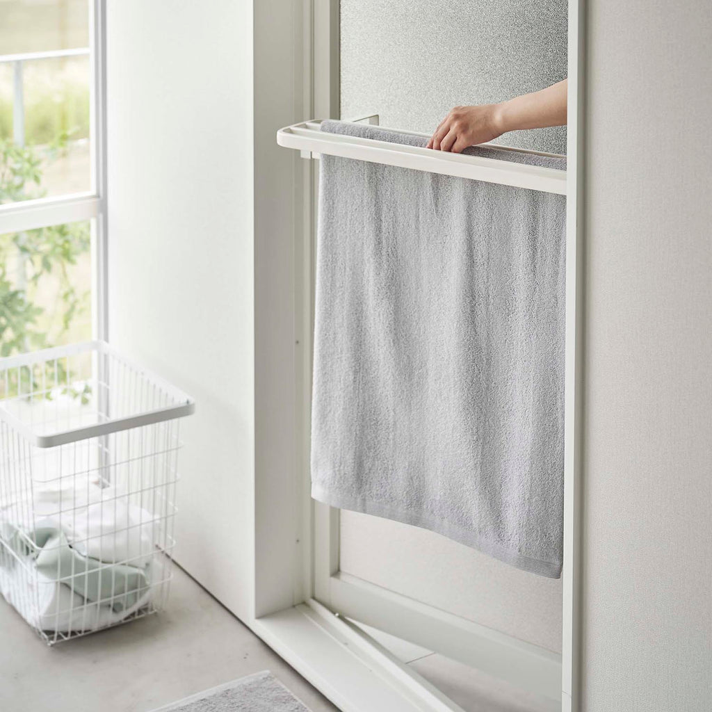 White Yamazaki Tower towel holder installed use view