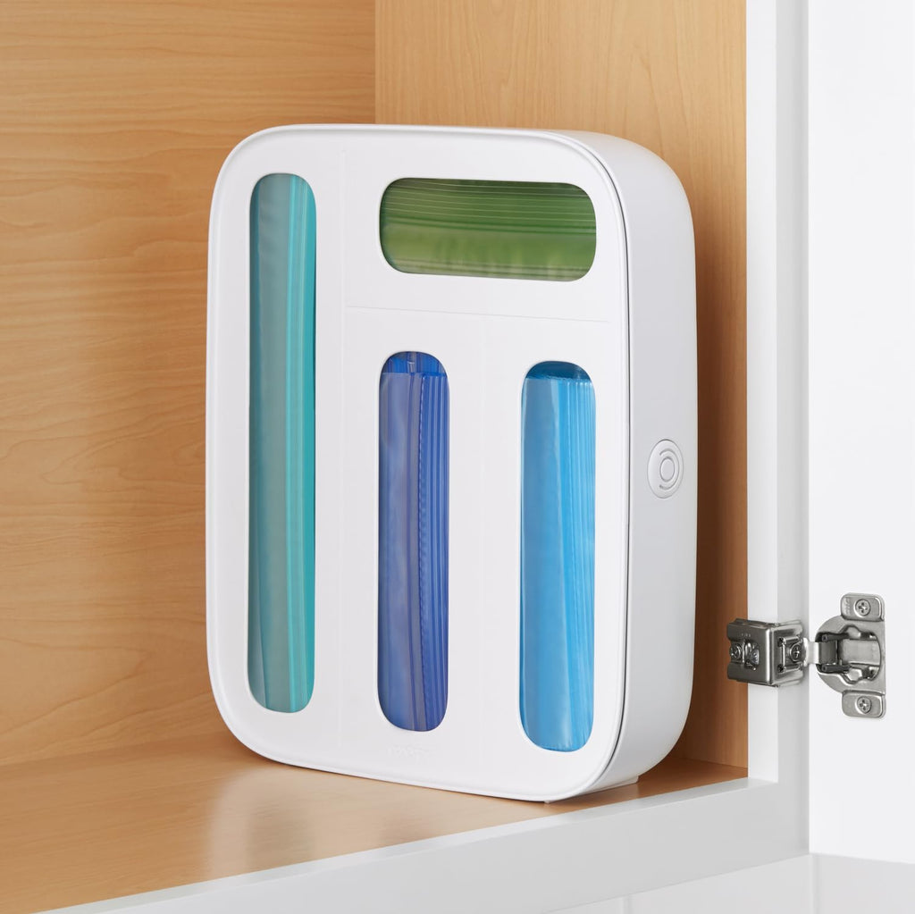 White YouCopia StoraBag dispenser in cabinet use