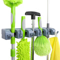 Gray Amazon Basics wall-mount broom and mop holder installed